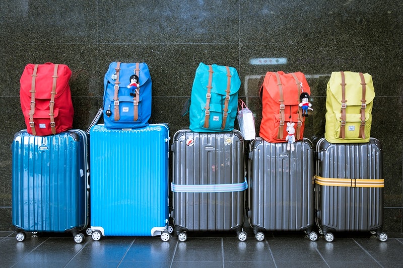 image of packed suitcases and backpacks for a big move to the UK