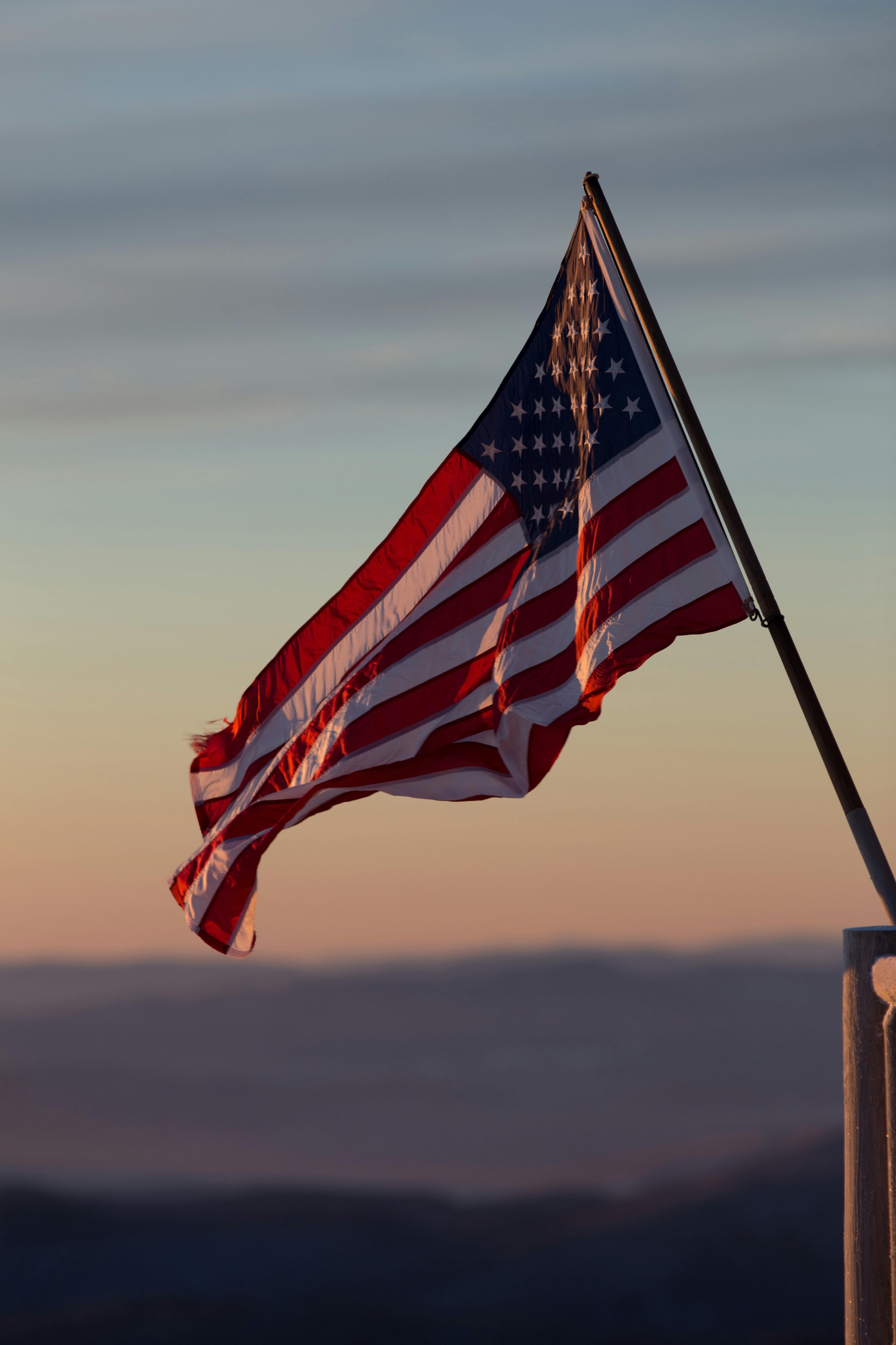 United States Flag blowing in the breeze at dusk